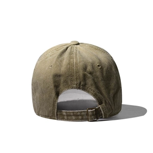 Detail of adjustable metal buckle and washed canvas texture on the army green baseball cap