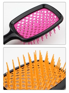 Detail of hollow vented hairbrush with colorful flexible bristles for fast blow-drying