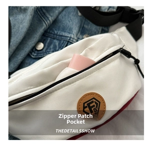 Close-up of durable oxford fabric chest bag with zipper pocket and leather logo