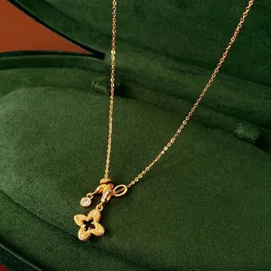 Gold Plated Copper Pendant Necklace With Hollow Flower Four Leaf Clover Inlaid Cubic Zirconia Fashion Jewelry For Women