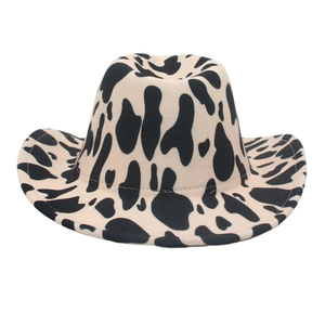 Classic wide-brim western cowboy hat featuring a trendy black and white cow print pattern