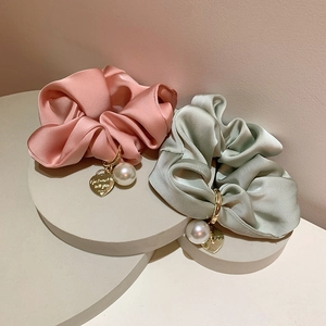 Elegant pink and green satin scrunchies with golden heart and pearl charms