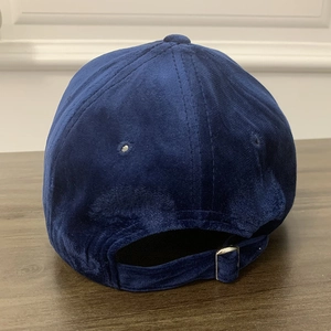 Detailed back view of dark blue velvet baseball cap featuring adjustable silver metal buckle