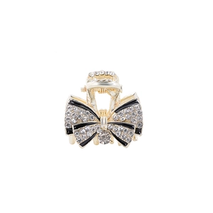 Exquisite gold metal bow hair claw with black enamel and sparkling rhinestones