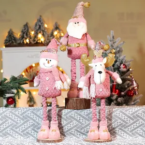 Pink and gold Christmas plush trio with telescopic legs including Santa, snowman and reindeer