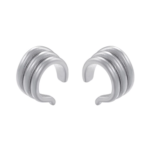 Close-up of silver triple-layered ribbed ear cuff with a polished C-shaped finish
