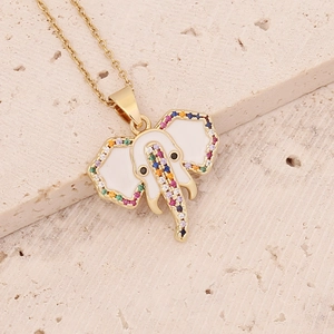 Macro view of gold elephant pendant featuring colorful zircon stones and white enamel detail