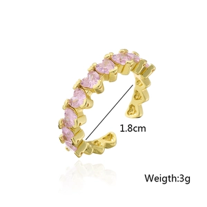 Detailed close-up of 18K gold plated ring with pink heart zircons and 1.8cm inner diameter