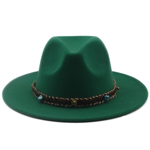 Close-up of the woven band with turquoise beads on a dark green wide brim fedora