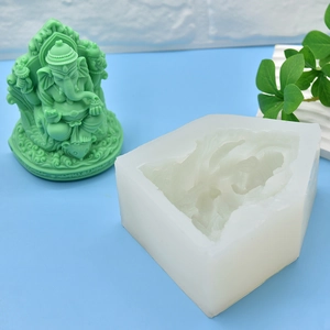 Ganesha silicone mold for DIY soap, candles, and cake baking with green finished statue