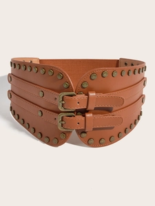 Close-up of vintage brown leather waist belt with bronze rivets and double buckles