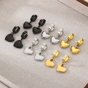 5-pair set of heart drop earrings in gold silver and black finishes on a fabric tray