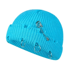 Bright blue distressed knit beanie with silver safety pins and metal rings streetwear style