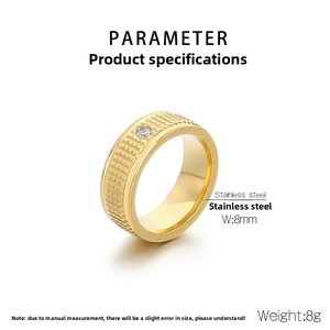 Detail of 8mm gold titanium steel ring featuring vertical stripes and a center zircon stone