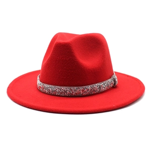 Classic red wool fedora hat with sparkling silver rhinestone band on white background