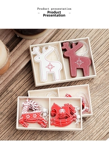 Detailed view of red and white wooden reindeer and rocking horse Christmas ornaments
