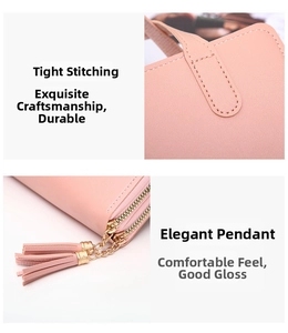 Detail of tight stitching and dual zippers with leather tassel charms on pink handbag