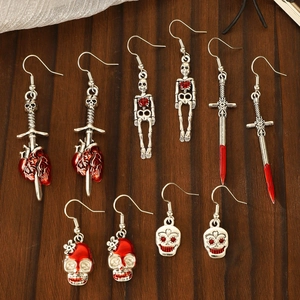 Gothic skull and heart cross earrings set in silver metal with red enamel details