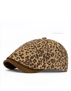 Side view of Khaki leopard print beret hat with dark brown brim on white background