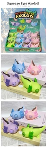 Detailed view of colorful popping-eye axolotl stress relief toys in a retail display box