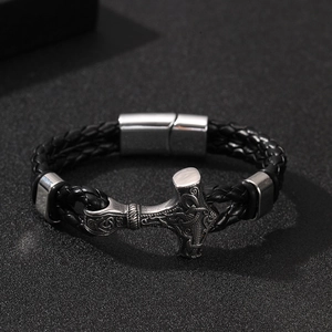 Viking Mjolnir braided leather bracelet with magnetic clasp on black background