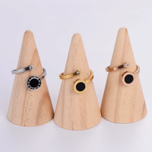 Detailed view of silver, gold, and rose gold Roman numeral rings with crystal accents