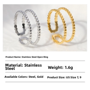 Macro detail of double-row beaded wave rings in silver and gold stainless steel
