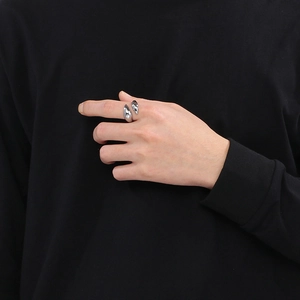 Detailed view of silver dolphin ring with sparkling cubic zirconia on a model's hand