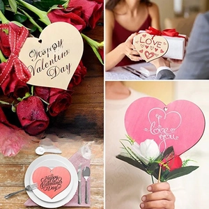 Macro detail of heart-shaped wooden gift tags with Love and Happy Valentine's Day printing