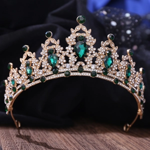 Macro shot of bridal tiara featuring green teardrop gemstones and crystal rhinestones