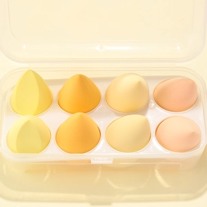 Detailed view of 8 soft non-latex makeup sponges in a clear storage organizer box
