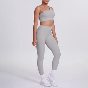 Side view of light gray one-shoulder yoga bra and high-waist leggings set for women