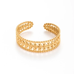 Golden titanium steel cuff bracelet with leaf patterns and delicate beaded edges on white background