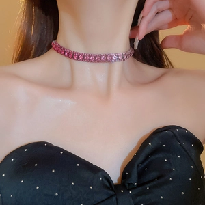 Close-up of elegant pink rhinestone necklace and matching earrings set on female model