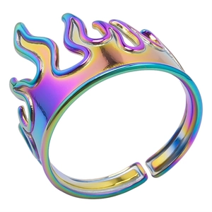 Detail of adjustable flame ring showing iridescent gradient finish and metallic texture
