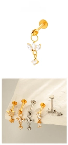 Macro detail of F136 titanium labret studs with zircon pendants and marquise chain designs