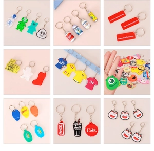 Collage of various PVC and acrylic keychains including cartoon characters and mini soda cans
