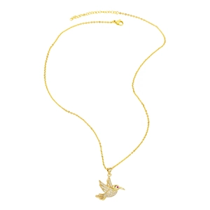 Detail of golden hummingbird necklace with micro-pave white crystals and red gemstone eye