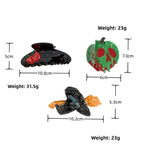 Detailed size and weight view of cherry, skull, and wizard hat acetate hair clips