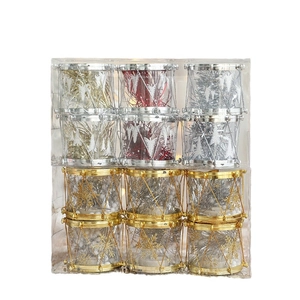 Set of colorful glitter Christmas drum ornaments in gold red and silver for festive decor