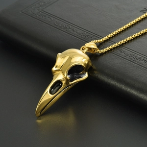 Gold punk raven skull pendant necklace for men in stainless steel on black background