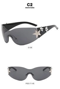 Detail view of Y2K star sunglasses with dark grey lenses and silver star accents