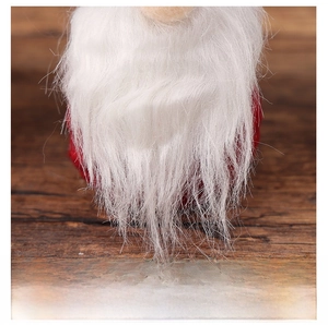 Detailed macro view of white faux fur beard on a faceless Christmas gnome ornament