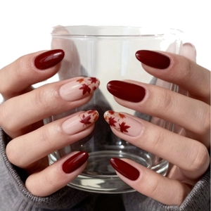 Autumn maple leaf press-on nails with burgundy and nude colors in almond shape