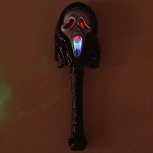 Macro shot of glowing Scream mask magic wand with multicolor LEDs and textured handle