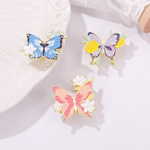Chic asymmetric butterfly and flower enamel brooches in blue, purple, and pink colors
