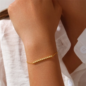 Close-up of elegant gold S925 sterling silver bracelet with sparkling row of diamonds