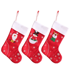 Three-piece Christmas stocking set featuring Santa, Snowman, and Reindeer embroidery