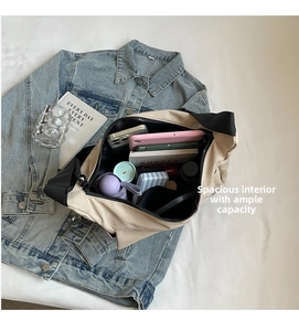 Detailed view of the spacious interior of this beige canvas tote bag with black contrast