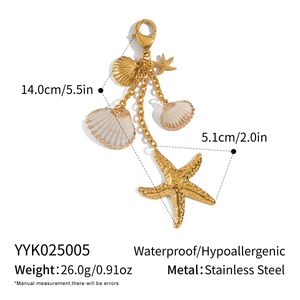 Detail view of marine style stainless steel keychain with white shell starfish pendant